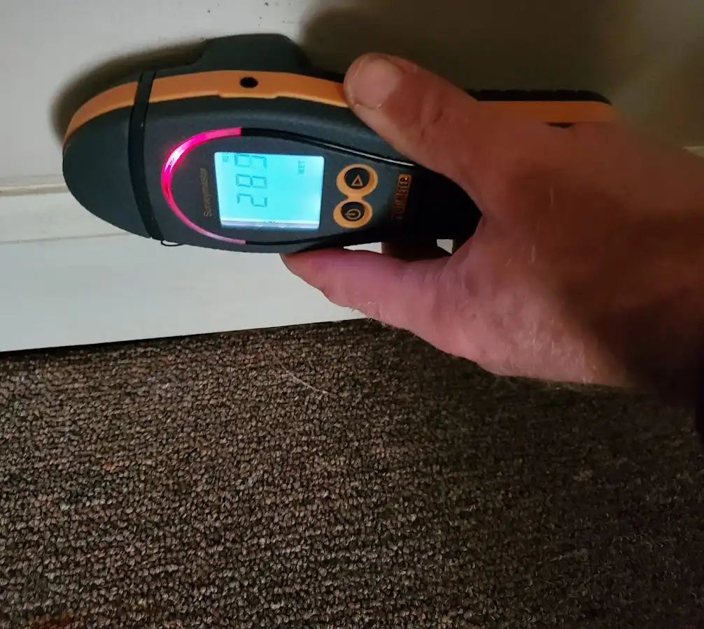 Moisture detection at baseboard during Storm Damage Restoration in Victorville